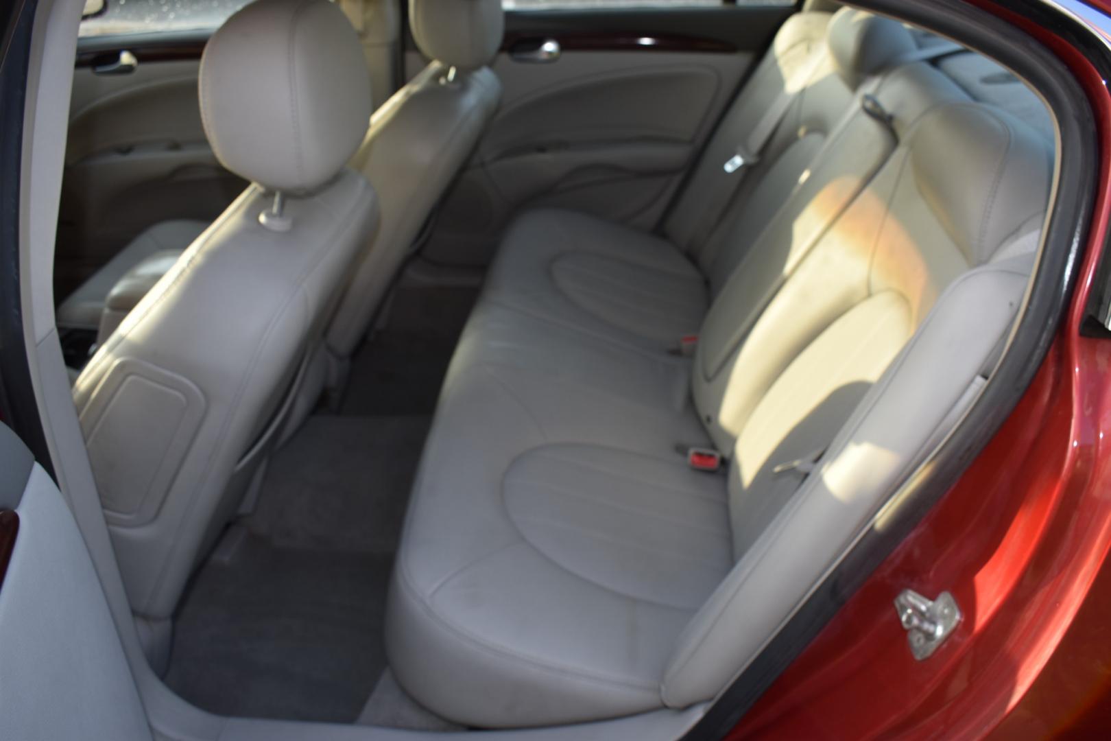 2007 Red /Tan Buick Lucerne CXL V8 (1G4HR57Y07U) with an 4.6L V8 DOHC 32V engine, 4-Speed Automatic Overdrive transmission, located at 5925 E. BELKNAP ST., HALTOM CITY, TX, 76117, (817) 834-4222, 32.803799, -97.259003 - Buying a 2007 Buick Lucerne can offer several benefits, depending on your needs and preferences. Here are some potential advantages: Comfortable Ride: Buick is known for prioritizing comfort, and the Lucerne is no exception. It typically offers a smooth and comfortable ride, making it ideal for lon - Photo#23